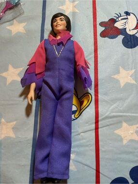 Vintage porcelain Donny Osmond doll has a broken arm